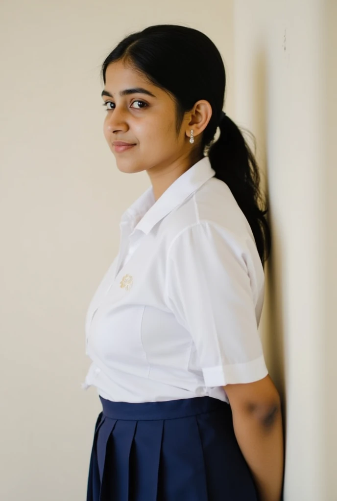 Photo of a young beautiful fat dusky 4th grade Indian school girl in school shirt and skirt from side  