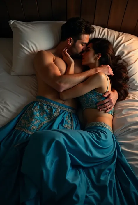  Women wearing hot blue lehanga and  laying in bed with man  wearing underwear  .and both  are hugging and kissing man  in romantic mood in bed 
