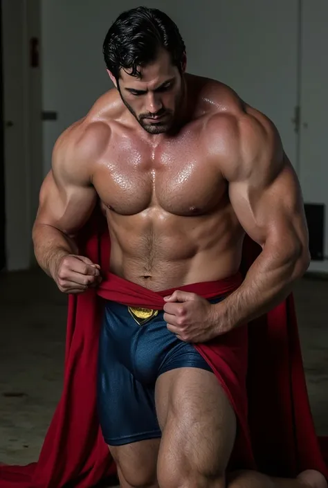 A handsome caucasian man with fair skin stripping off his superman costume, blue eyes, sweaty body, kneeling