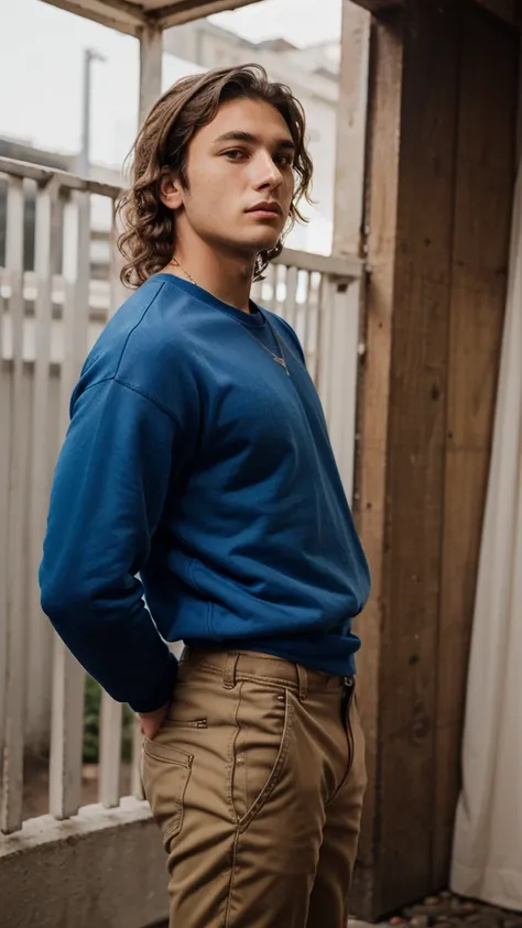 20-year-old man, brown, wavy hair stripped style ,Alto Beirando 1 .92 , well-marked jaw , slim defined, sexy and boring look ,  is wearing a blue sweatshirt and cargo pants 