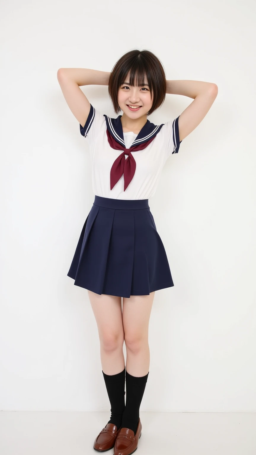 The image showcases a cheerful woman with short, dark brown hair with bangs, smiling against a plain white background. She has a fair complexion and a relaxed posture, with arms raised behind her head. Dressed in a short sleeve white blouse with a navy blu...