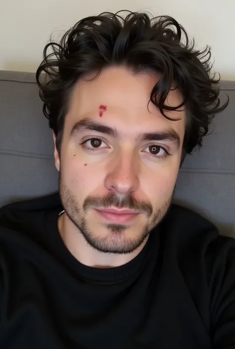 A face selfie of man with slight-curly messy slight-wet black hair , he has a wide face and beautiful jawline with beard, and he has a wound on the right side of his face, he relaxed on a gray couch and he wears black sweater 