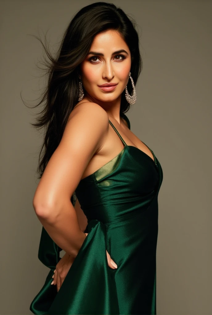 Katrina Kaif, Bollywood actress, captured in a glamorous portrait. Slim, toned physique with a graceful posture, wearing a shimmering emerald-green evening gown that hugs her athletic frame. Her signature dark-brown, almost black, long silky hair cascades ...