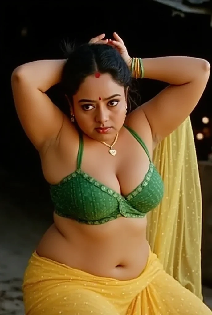 photo of curvy woman with dusky skin, wearing Transparent chiffon yellow saree and green strapless sleevless Blouse, showing her large U cut Cleavage, Red Sindoor on her forehead, Both hands streched up above head showing dark hairy armpits, Hair messed up...