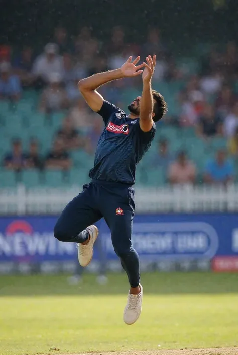 In cricket a man with dar blue jersey catching a ball in flying style 