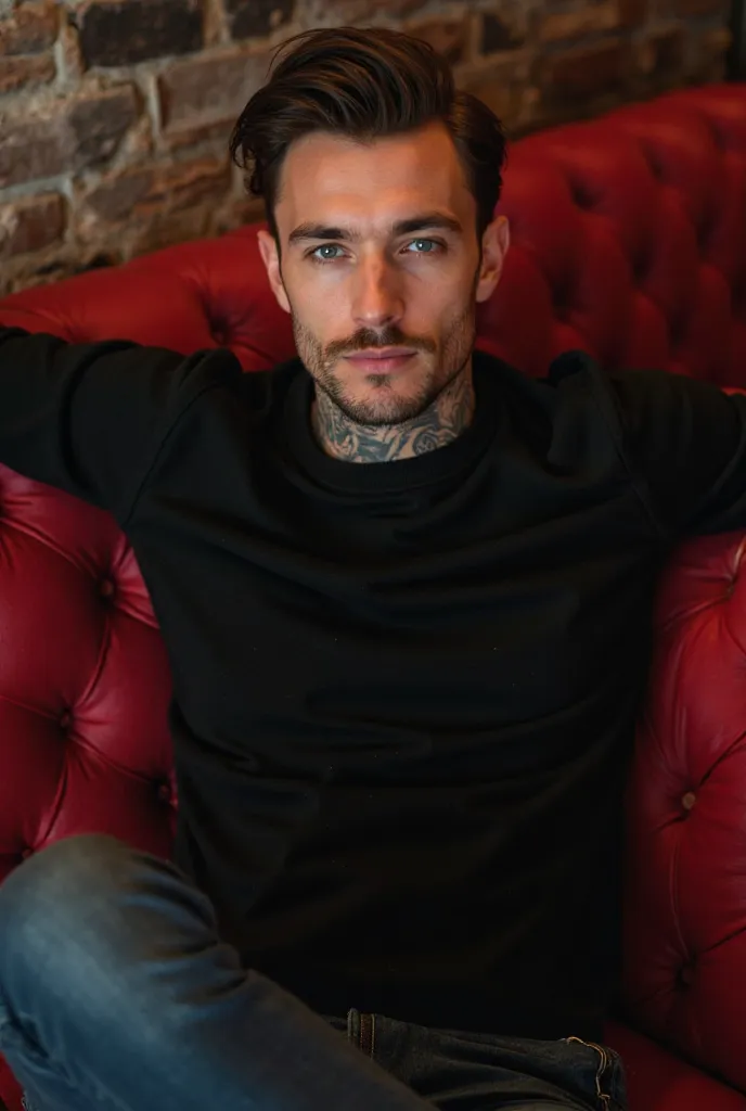 Handsome man with a square jaw, Broken jaw, high, muscular arms with tattoos, he is sitting on a red couch, tattoos leaning back as if you had all the control, with arms outstretched from a club, Wearing a black sweater with her blue eyes fixed on the fron...