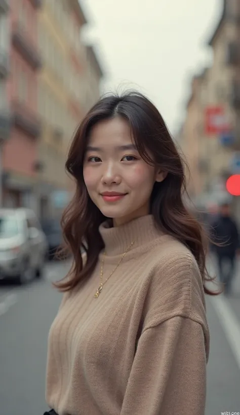 Sofia wearing a skin-colored sweater is met with a small smile on the blurry street