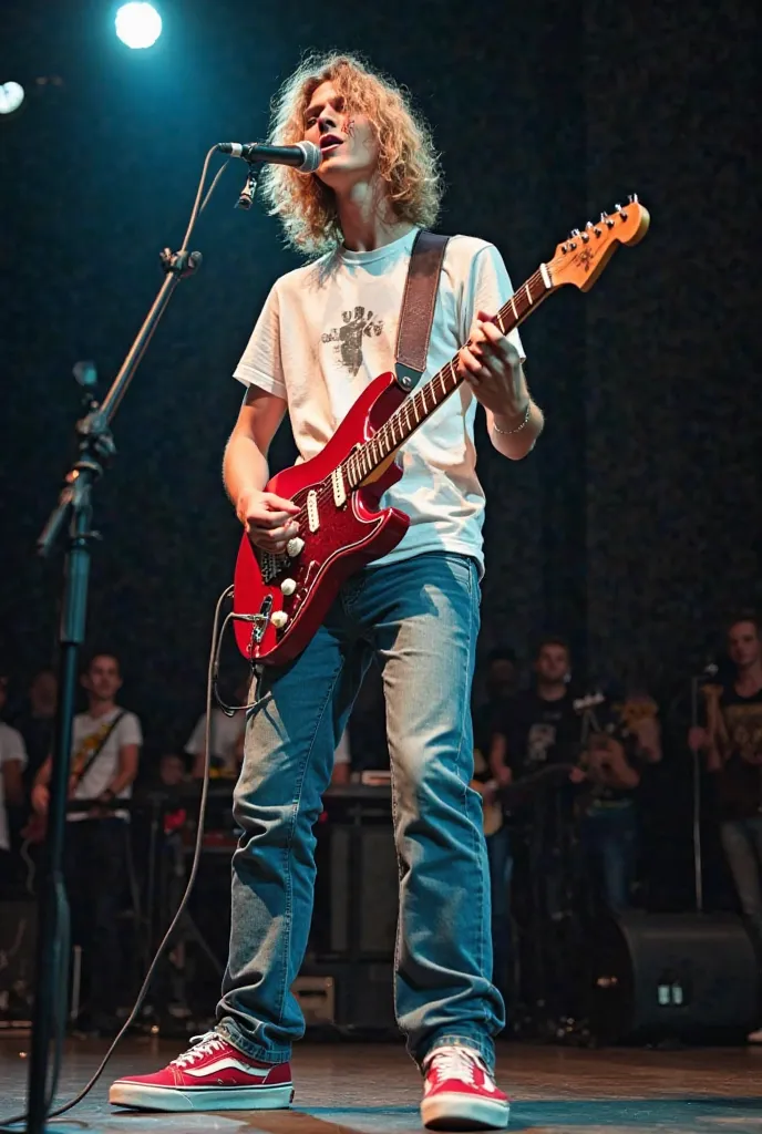 Photo of a young singer, man, full body, dressed in a slightly torn white t-shirt, classic jeans and vans in red colors, blue and green.  wavy blonde hair ,  thick eyebrows, white skin. He has a black out on one of his arms. He is singing on a stage and pl...