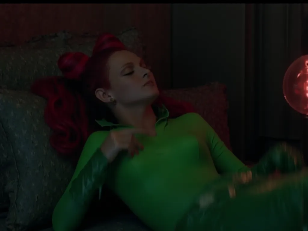 poison ivy laying in bed, touching her breasts, moody lighting