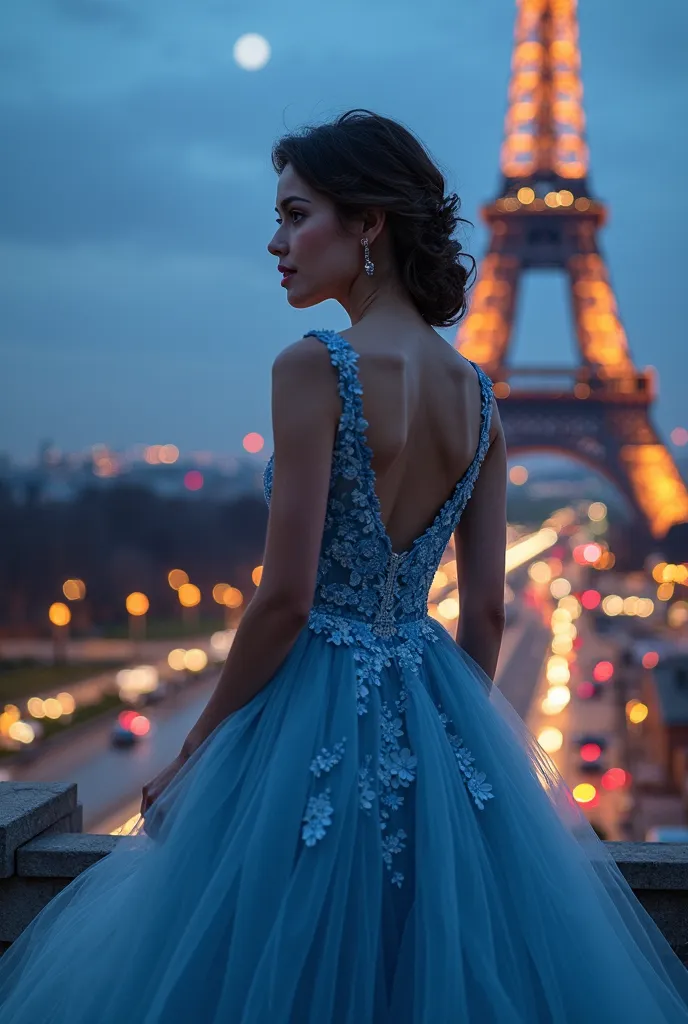 A maid of honor in a blue dress in Paris at night near the Ephelius Tower