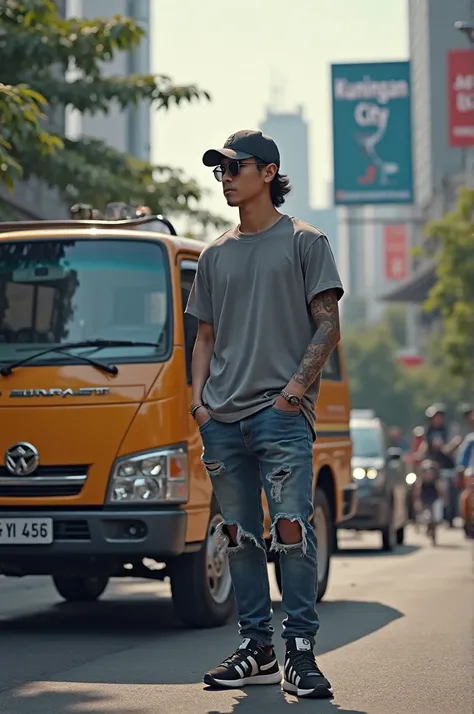 A sports minibus on the streets of the capital stands a young Indonesian man 35 years old softball hat semi-long hair sunglasses sunglasses T-shirts ripped jeans shoes sneakers hands tattooed with a standard body under a billboard that says Kuningan city t...