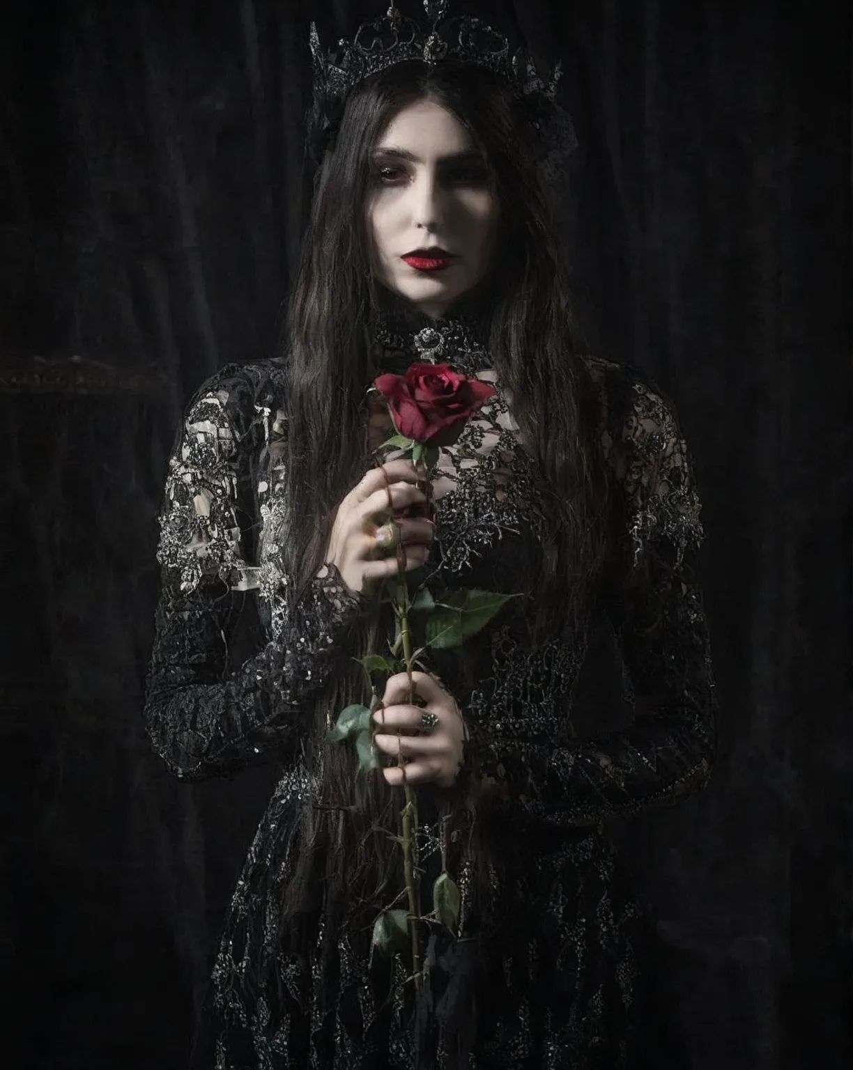 arafed woman in a black dress holding a rose in her hands, she is the queen of black roses, gothic princess, gothic style, gothic fashion, gothic clothing, wearing modern gothic clothes, goth woman, an elegant gothic princess