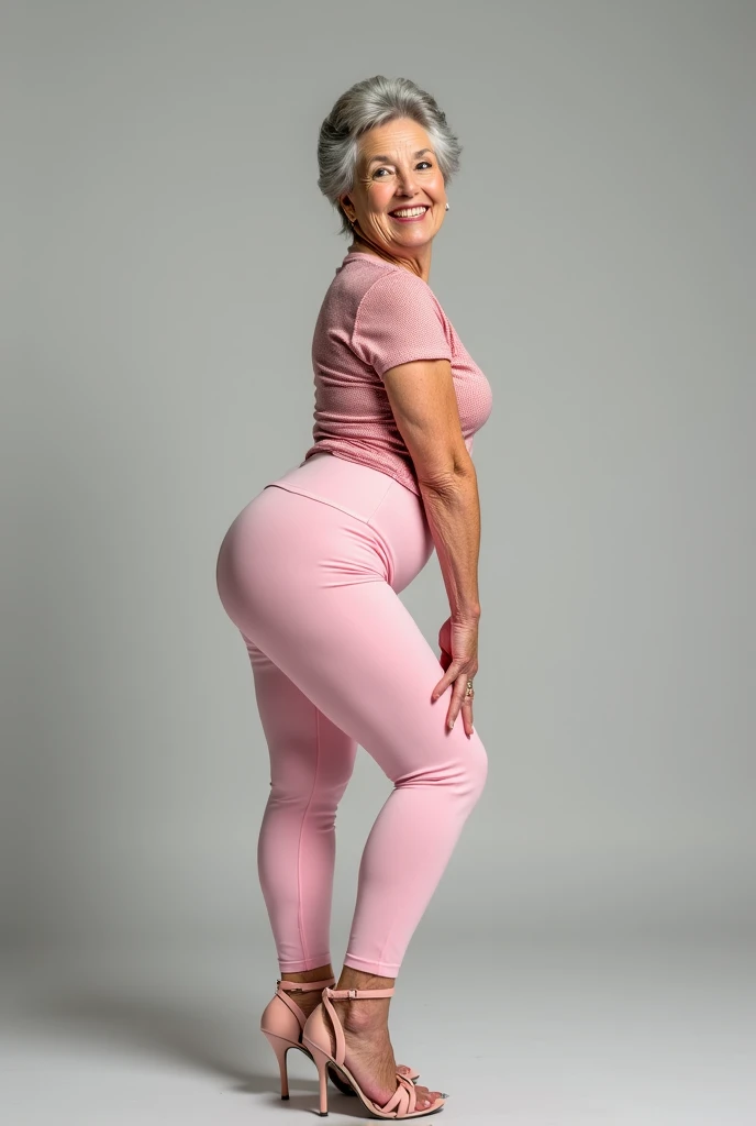 Old woman showing her ass wearing light pink leggings for the camera and smiling wearing high heels