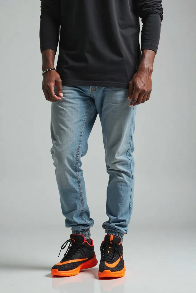 Picture of a human wearing shop lebron 19 XIX( orange  sole own)shoe with light blue jeans with black long sleeve t shirt