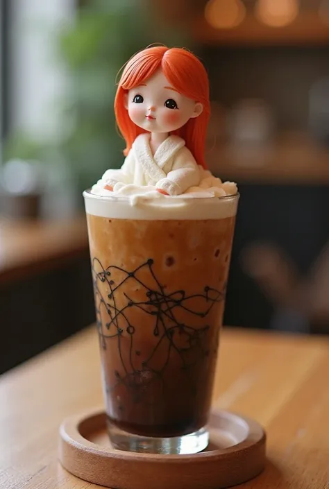 A large clear plastic glass.the glass is a cold coffee. looks very delicious. There is a small marshmallow in the shaped of full body of a girl ( with red hair ). Sitting on top of the drink, looking cute and neat. On the glass is printed the shop's brand ...