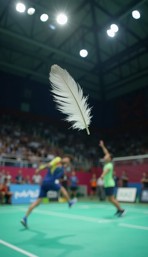 A single feather floating in the air. A badminton player jumping high in the air in the background, attempting a jump smash. The crowd is chanting. The lighting in the badminton court is bright, cinematic and dramatic.