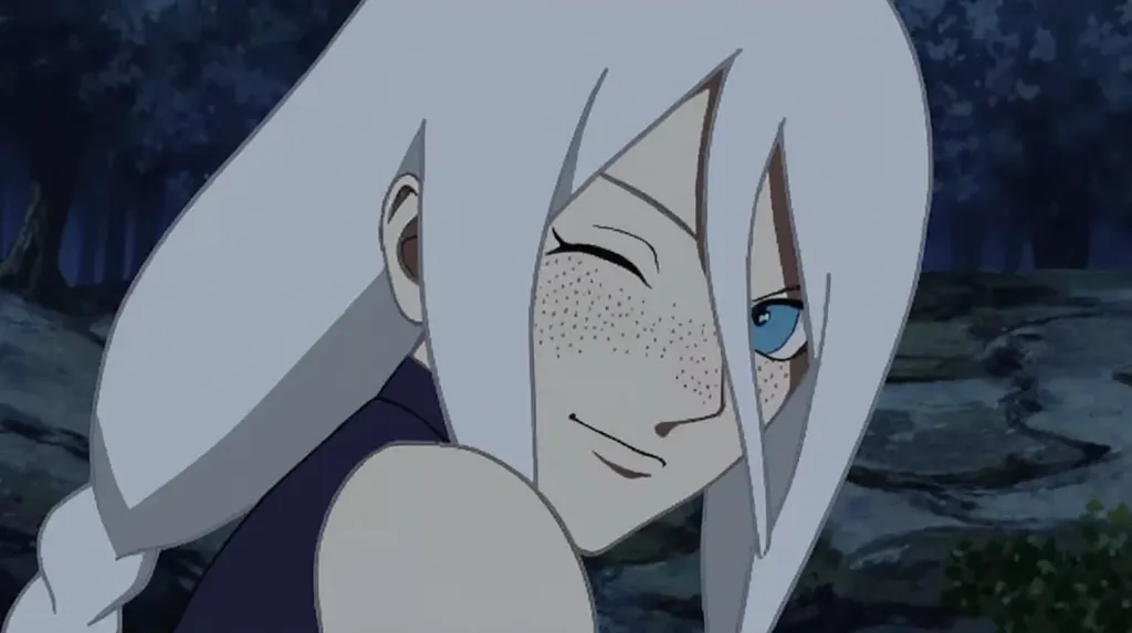 A screenshot from Naruto Shippuden features a kunoichi with white hair that has a bluish tint, blue eyes, and freckles. She has a serene expression and a gentle smile. She wears a cropped, light blue and white jacket with wide sleeves over a navy blue stra...