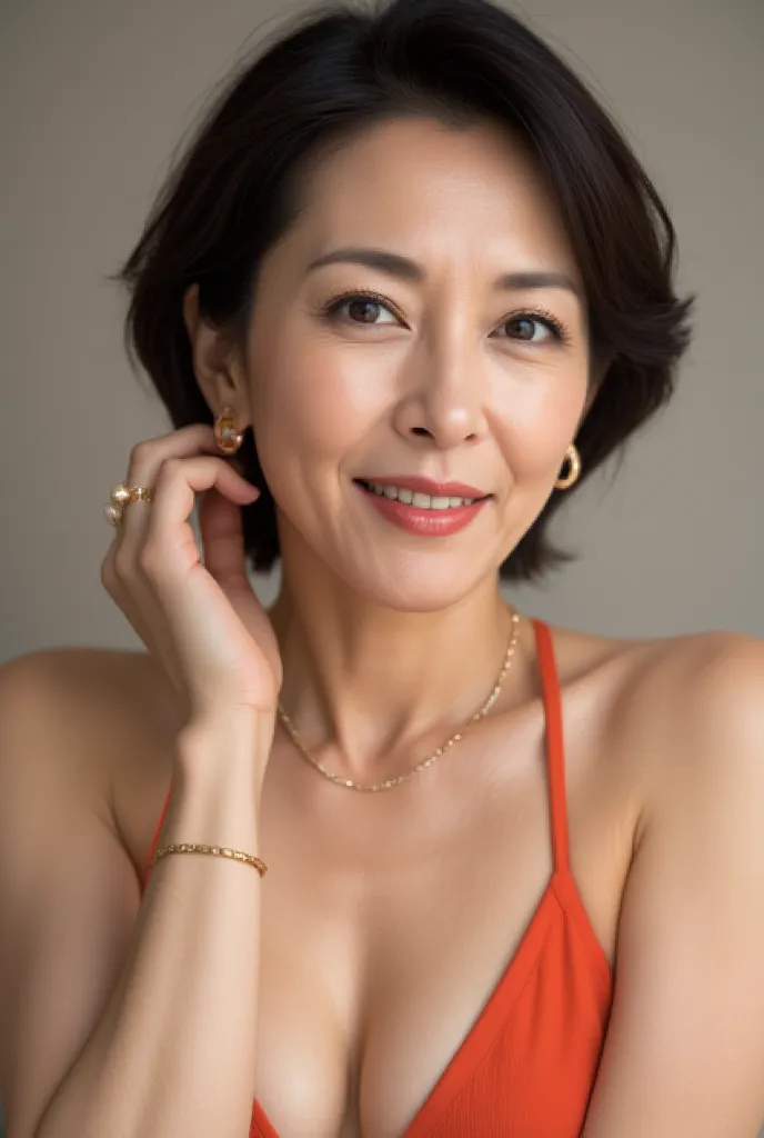 A close-up catalog image of a 46-year-old Japanese woman wearing an orange separate-type swimsuit with elegant jewelry and bold makeup. She has a voluminous curled hairstyle, bright coral lipstick, glowing bronzer, shimmering champagne eyeshadow, and long ...