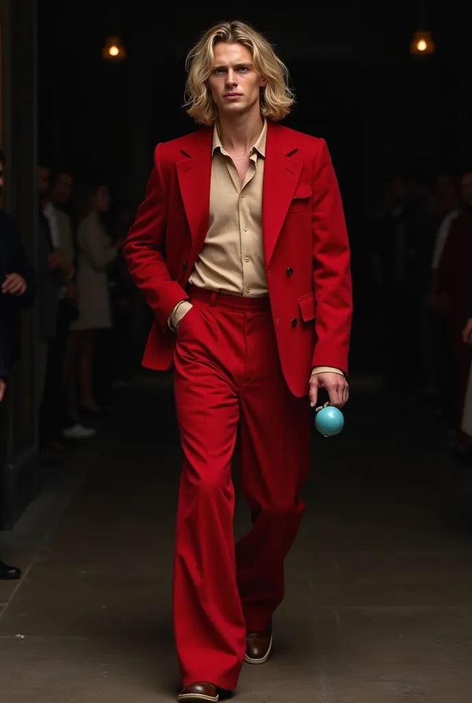 A tall blond haired man in his 20s is walking in red loose suit pants and matching jacket beige shirt with a blue apple in his hand. The background should be dark and the man should look very good . Your hair should not be long rather medium in size and a ...