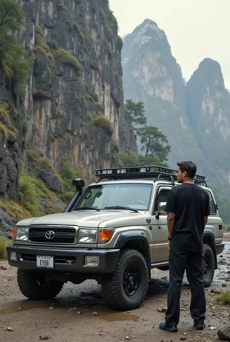 Toyota Land Cruiser LC100 2005, background in a Stone Mountain, aman with black shirt long black pants standing in front of car and look at car