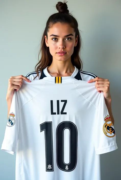 A woman wearing the Real Madrid number 10 jersey that has the name Liz on the top of the super realistic shirt that the woman is holding a Real Madrid flag on her back 