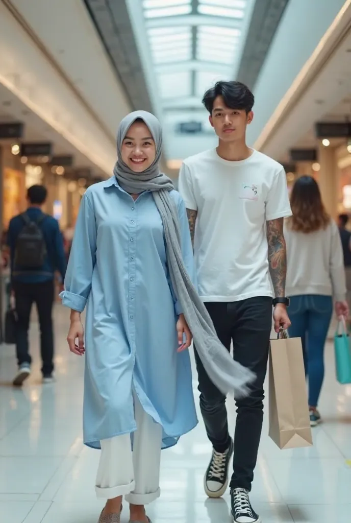 A beautiful young Indonesian woman smiling facing towards the camera with white face glowing natural pink lips wearing a long shirt in blue color Dongker plain shiny wears long white jeans wears a hijab pashmina meleyot silver color is walking step along w...