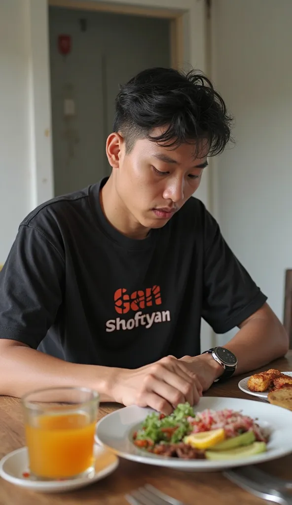 a young Indonesian man, age 20's , black t-shirt with the words 'Gan Shofyan' using Indonesian sarung fabric. Sitting holding back thirst and hunger while looking at the watch. Daytime atmosphere in a simple house paint White color and a table full of food...