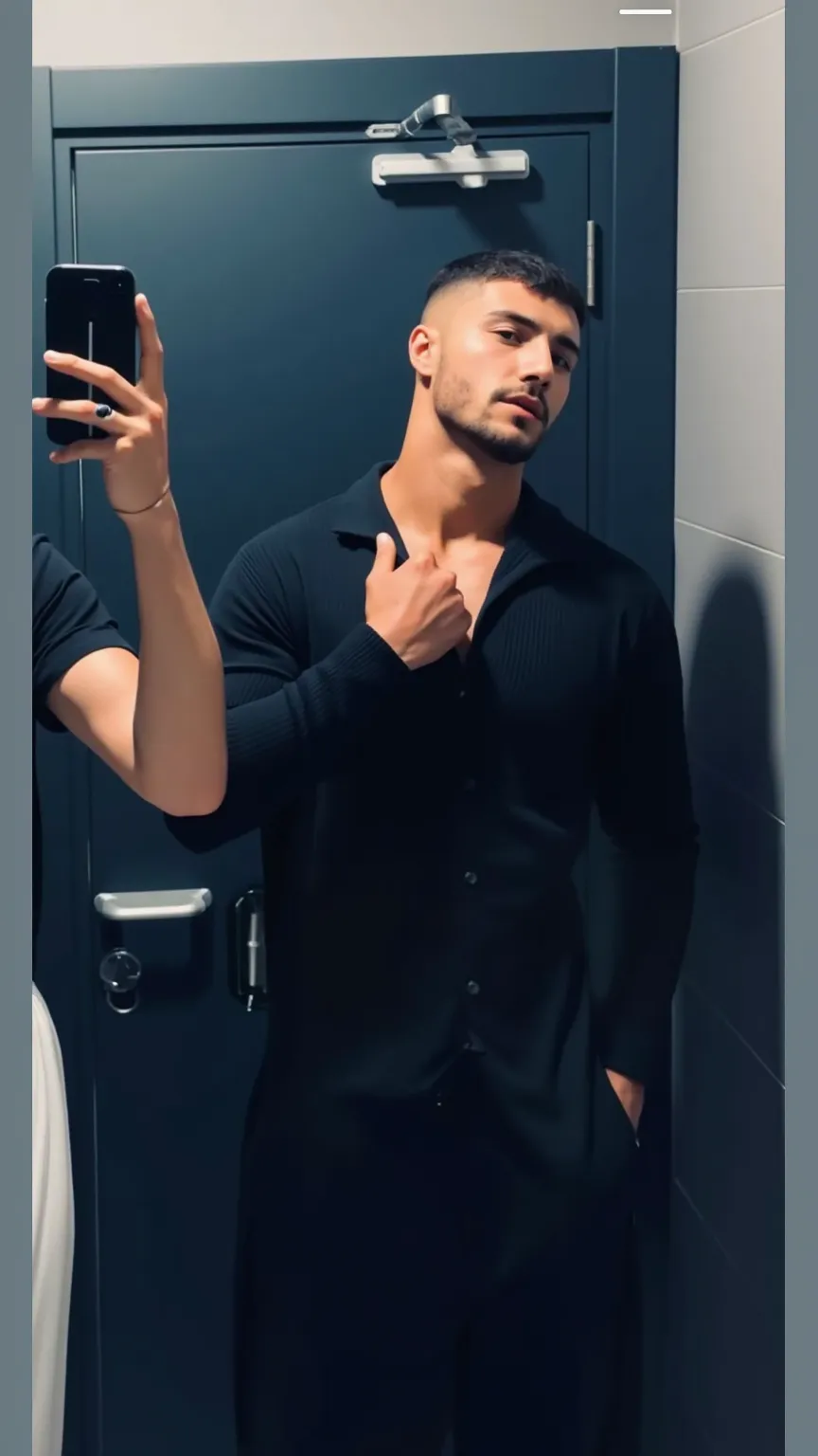 a handsome young turkish guy with muscle, dark very short hair fade and goatee beard wearing a white tshirt and a black long pufferjacket, 8k, hyper detailed, dramatic lighting, cinematic, photorealistic, unreal engine, sharp focus, physically-based render...