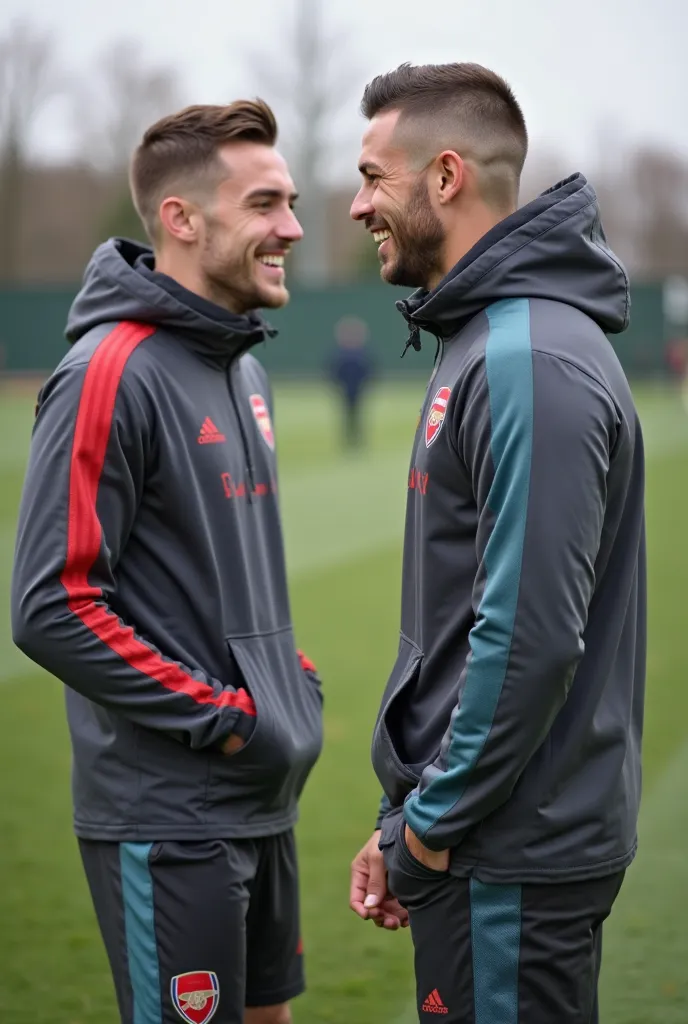  handsome man , Half-shaved hair with faded cut, blue eyes, No facial hair and athletic body. dressed in a sweatshirt from the Premier League team, Arsenal talking to his teammate on the test field. Laughing and with a soccer ball