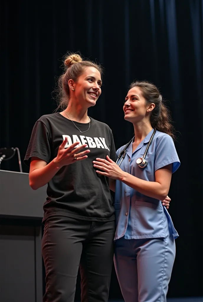 Create a high-resolution image of a woman standing on a modern, dark-colored stage, giving a TED-style talk. She is wearing a black t-shirt with the name "Daebak" in bold letters on the front. She is embracing a nurse who is standing beside her, with a loo...