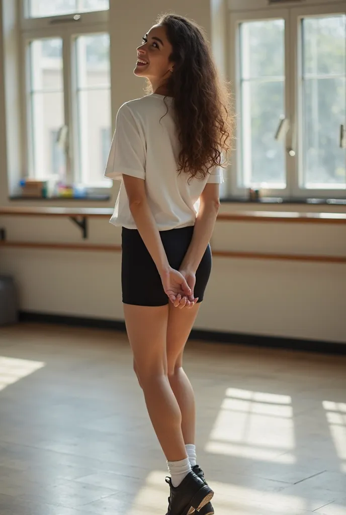 Smileling Long-haired, college student in a white tshirt with clover, short black leotard bottoms, white socks, and black leather tap shoes, hands behind back, jumping, practicing tap dancing in a dance studio
From Behind, 