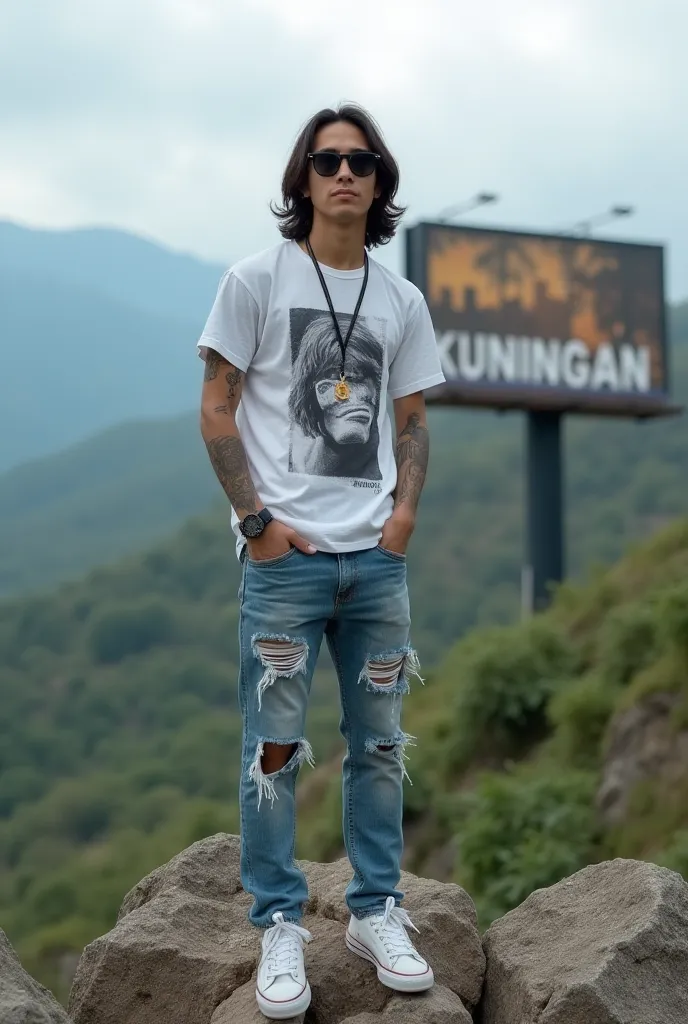 A young Indonesian man aged 35 years old semi long hair t-shirt hand tattooed ripped jeans wearing a sneaker sunglasses standing on the rocks of the hills background with a billboard that says Kuningan city looks realistic 