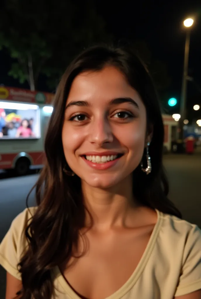 The photograph is a close-up portrait of a young woman, likely in her late s or early twenties. She is the clear focal point, occupying most of the frame. Her expression is one of genuine, bright happiness; she has a wide, open smile revealing her teeth. H...