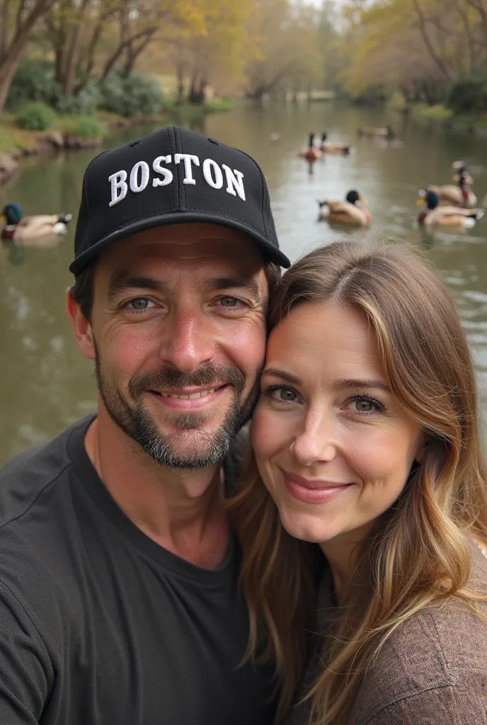 The same, but they are both adults and the boy has a black hat with the letters of Boston on it.. In the background there is a pond with ducks