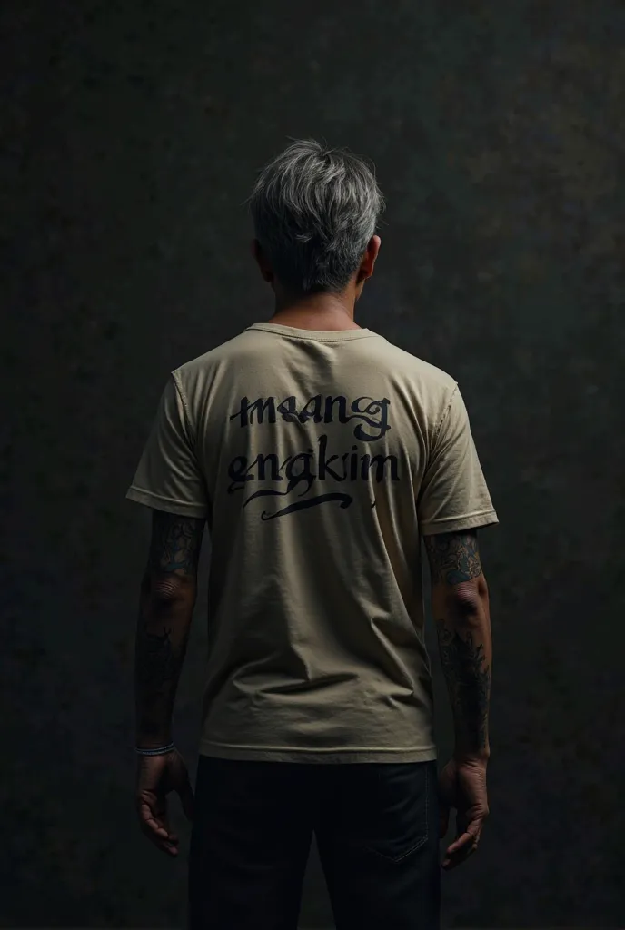 The black wall of a young Indonesian man aged 45 years old standard body trousers facing backwards and semi-long hair with tattooed hands wearing a T-shirt that says MANG ENGKIM looks realistic 