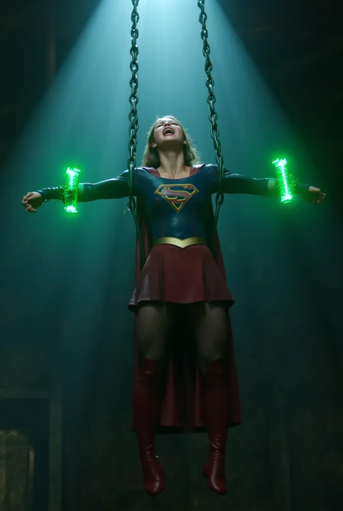 Melissa Benoist as Supergirl, the Supergirl is laying down flat on the floor, her hands is tied over her head with chain, she is hanging from the ceiling, her both arms are tied with a green lighting chain, a lot of chains wrapped around her wrists and nec...