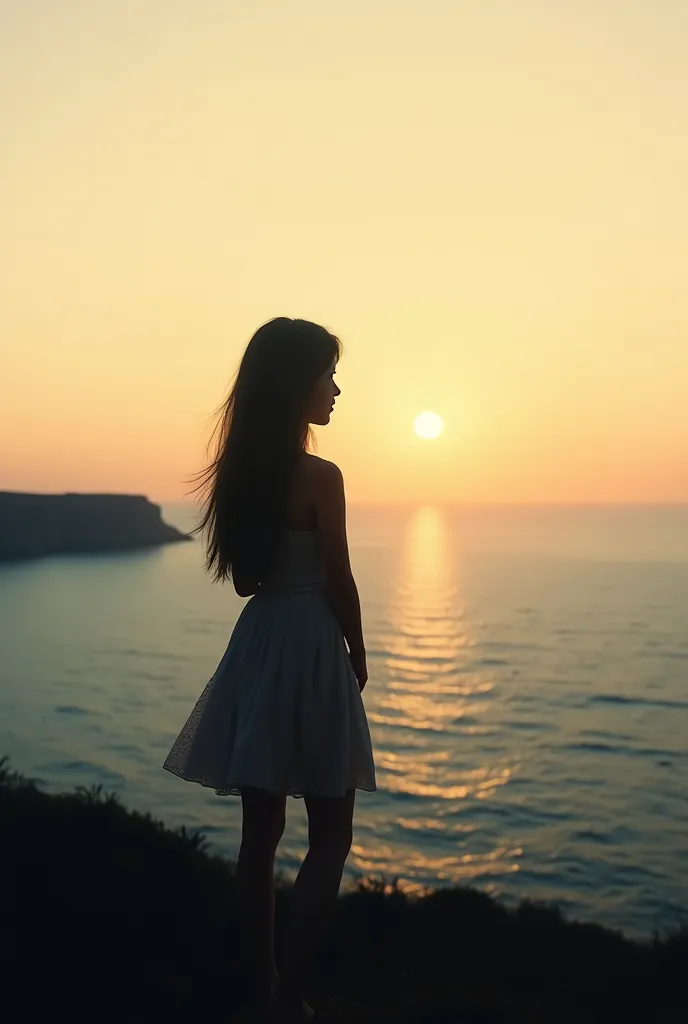 Silhouette of a current girl looking at the sea in the distance in a nostalgic way