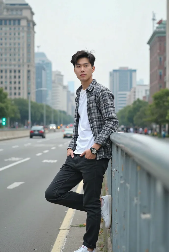 A tall Korean guy wearing a white color shirt and a silver black plaid shirt outside wearing black jeans poses facing the camera standing leaning against a wall with one leg raised on a highway background theme with beautiful classic buildings