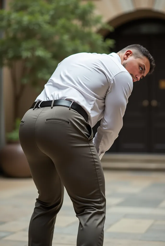 Fotografía realista, 35-year-old muscular (((atletic man))) , , View from below, nalgon de perfil, stripe white formal shirt and very tight dark khaki trousers, brown belt, de perfil, Big butt, viendo a cámara, ojos negros, en el patio, hombre sexy, muy na...