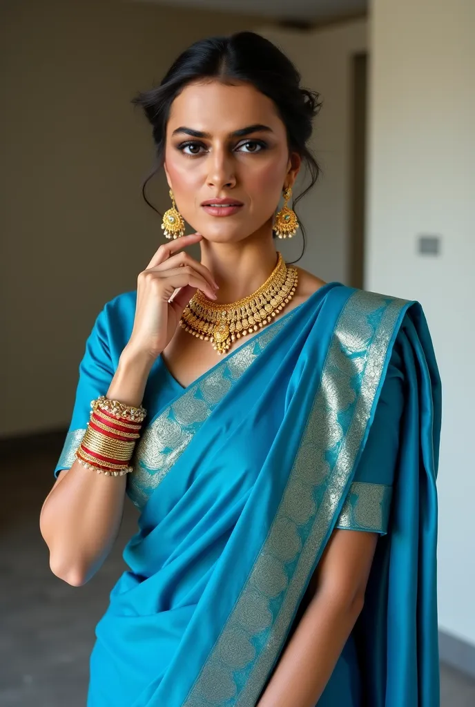 A wife in blue saree and frount camer and a jewellery set 