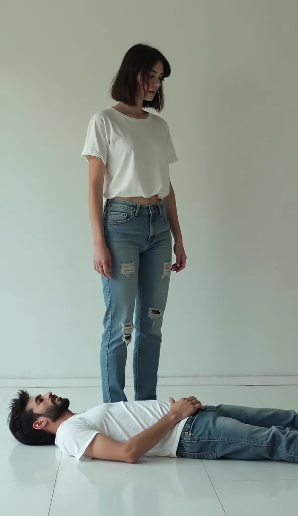 a guy dressed in jeans and a white T-shirt is lying on the floor. A woman dressed in jeans and a white T-shirt is standing on the guy's chest with her feet
