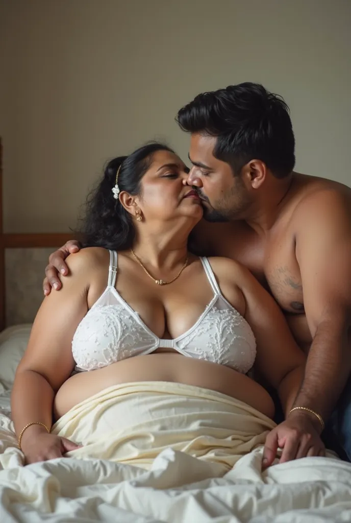 Indian 60 year old bbw chubby plus sized wife ,(wearing white colour transparent deep neck  cleavage bra, very huge swooping breasts) and 27 year old shirtless man driver kissing on bed. very bright light, front view 