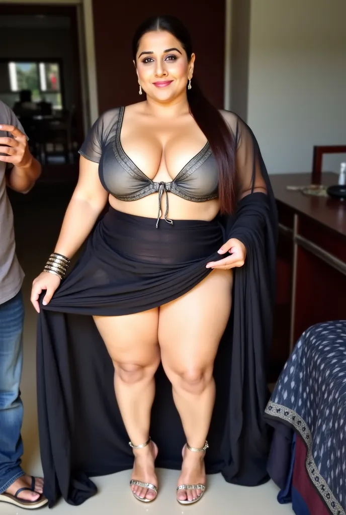 Indian beautiful woman sexy curvy plus size model wearing transparent black color saree without blouse facing to camera in sitting on a bed with her curvy legs wide open with view of her panties,head to thighs view, curvy plus size figure,big m-cup breasts...