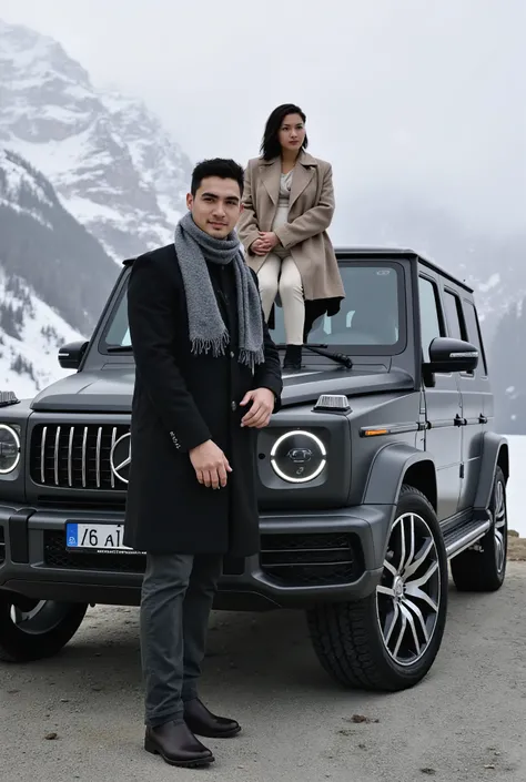 A young man and a woman stand together in a wonderful mountain place similar to the Alaskan mountains, surrounded by beautiful landscapes of snow and rugged mountains that reflect the beauty of wild nature. The weather is very cold with a foggy atmosphere,...
