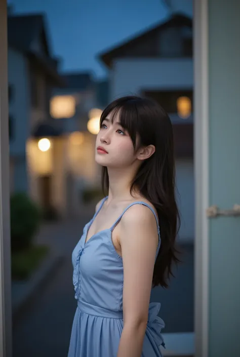 A beautiful Japanese woman wearing a flowing blue mini dress, standing alone on a small balcony at night, feeling the gentle night breeze. Her hair and dress move softly with the wind. She looks up at the sky with a dreamy, distant gaze, illuminated by the...