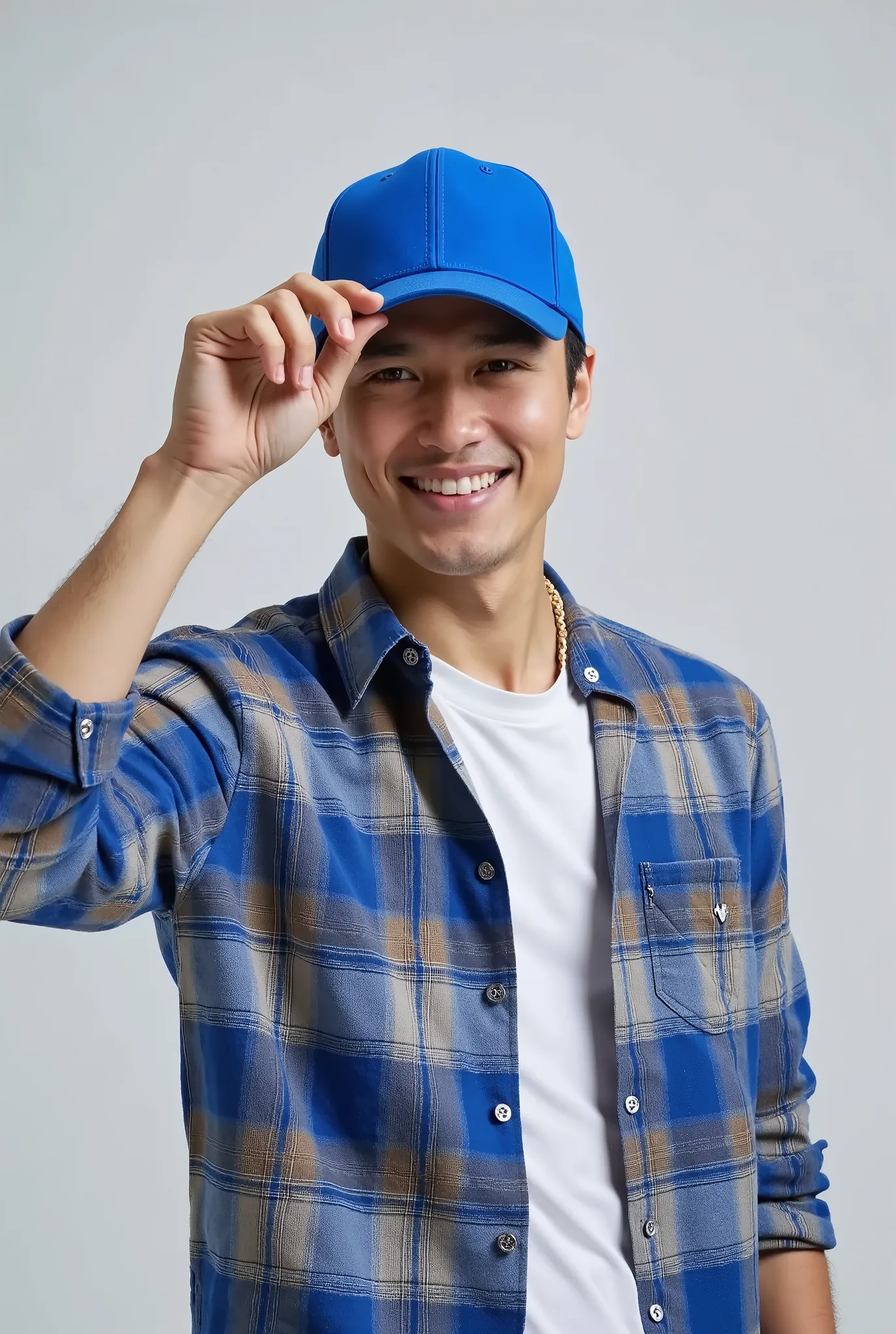 A man wearing a simple blue cap and a plaid shirt, tilting the head slightly downward, while holding the cap brim with one hand. The background is simple and light gray . Your expression is relaxed and cheerful, and his face is partially obscured by the c...