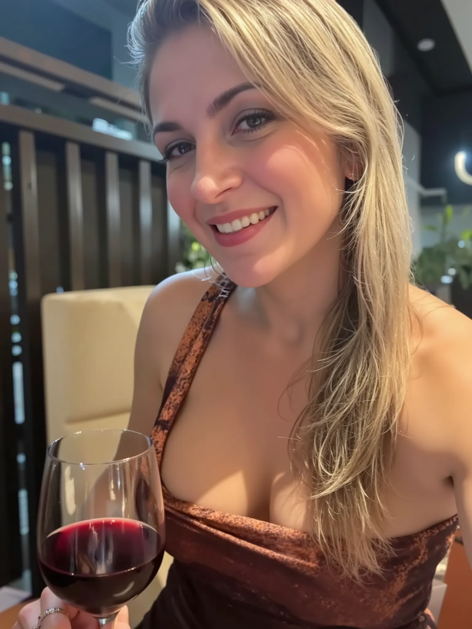 Beautiful married woman 45 years old She has big breasts that keep showing at the neckline. She is looking seductively at the photographer while holding the wine glass sensually. 