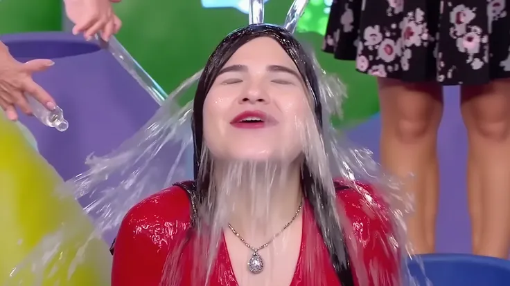 High-definition capture of a stunning and glamorous mixed-race woman, half white and half black, with long flowing black hair, aught in a dramatic moment as she is being drenched in crystal clear water, water pouring down over her head and face in slow-mot...