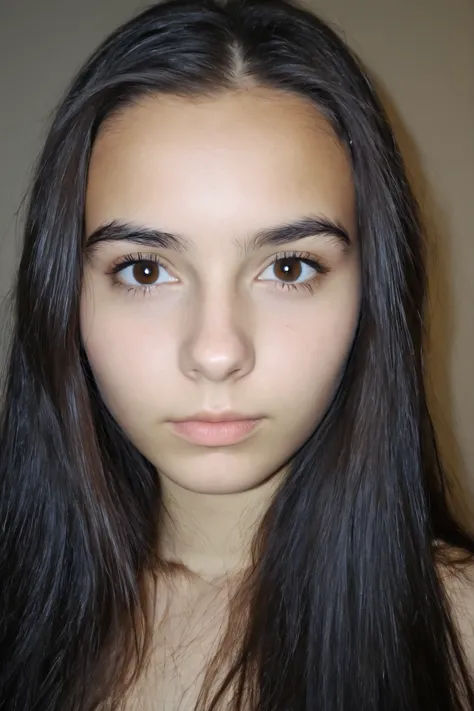 The photo shows a girl. She has dark, straight long hair with an even cut, and her skin is light and even. Her eyes are brown with a soft expression, and her eyebrows are dark and naturally shaped. she looks straight at the camera , full face.