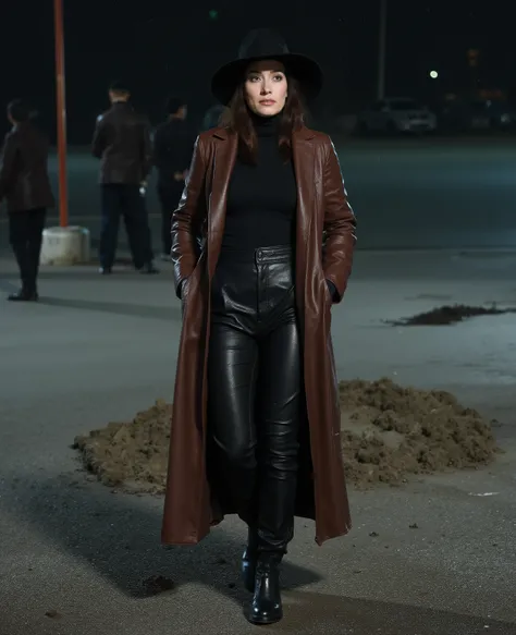 A tense and watchful 35 year old 200 pound police woman with very long straight brunette hair wearing a black wide-brimmed hat dressed in a black turtleneck under a very long black ankle-length vintage cowhide leather duster coat that is highly polished br...